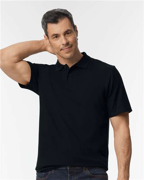 Gildan Unisex Softstyle® Pique Polo — Black — On model · front