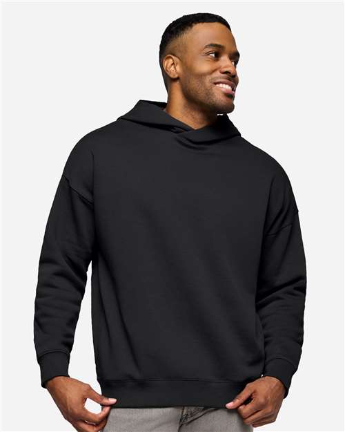Live & Tell by LAT Unisex Heavyweight Hoodie Sweatshirt — Black — On model · front