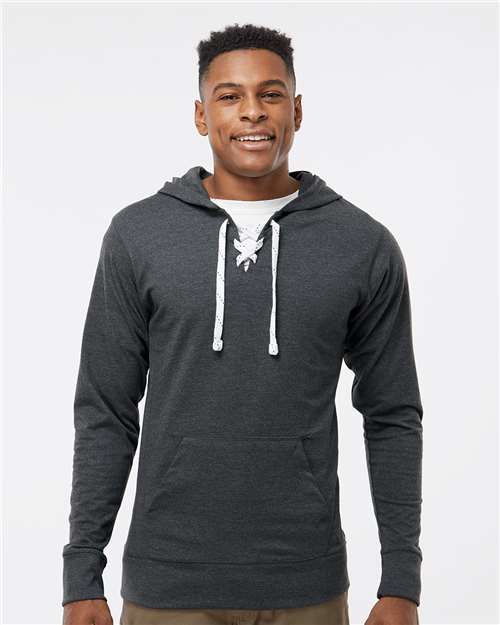 J. America Unisex Jersey Sport Lace Hooded Pullover — Charcoal Heather — On model · front