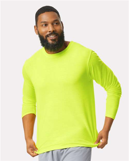 Gildan Unisex Performance® Long Sleeve T-Shirt — Safety Green — On model · front
