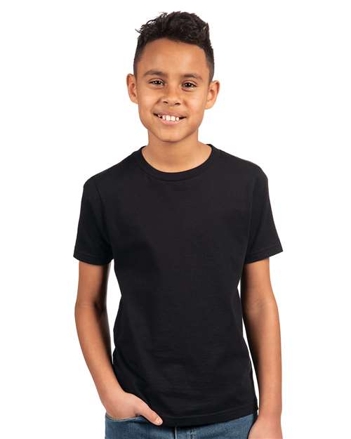 Next Level Youth Cotton Tee — Black — On model · front
