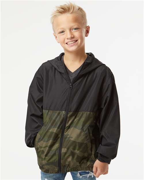 Independent Trading Co. Youth Lightweight Windbreaker Full-Zip Jacket — Black/ Forest Camo — On model · front