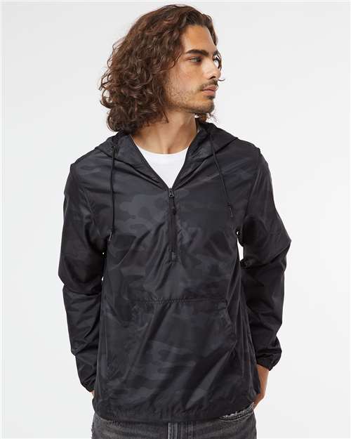 Independent Trading Co. Unisex Lightweight Quarter-Zip Windbreaker Pullover Jacket — Black Camo — On model · front
